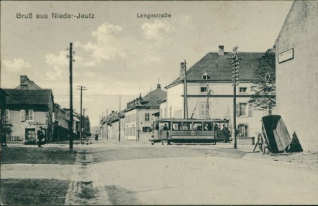 Alte Ansichtskarte Nieder-Jeutz / Yutz, Langestraße mit Straßenbahn