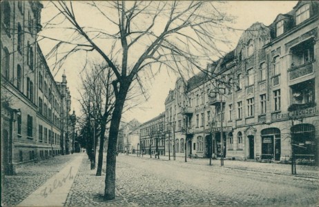 Alte Ansichtskarte Tilsit / Sowjetsk, Bahnhofstraße mit Bahnhofs-Hotel und Dragonerkaserne
